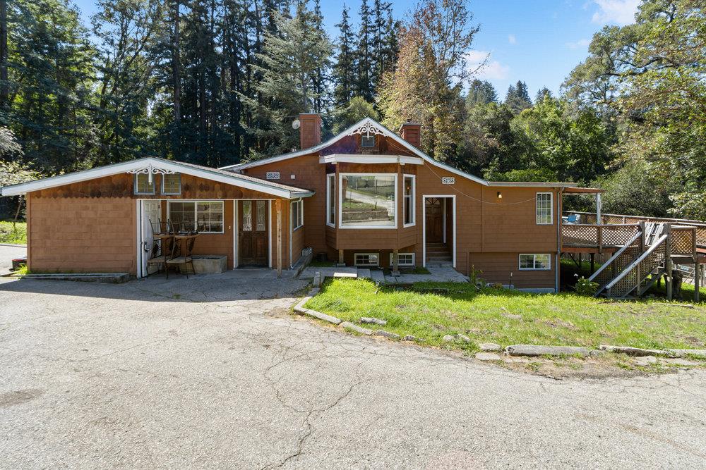 1003 Laurel Glen Road Soquel, CA 95073 - Photo 60 of 115 a front view of a house with a yard and garage
