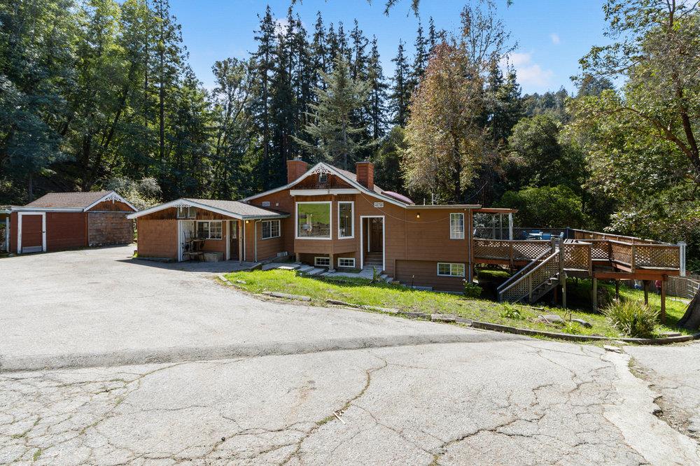 1003 Laurel Glen Road Soquel, CA 95073 - Photo 64 of 115 a front view of house with yard and trees in the background