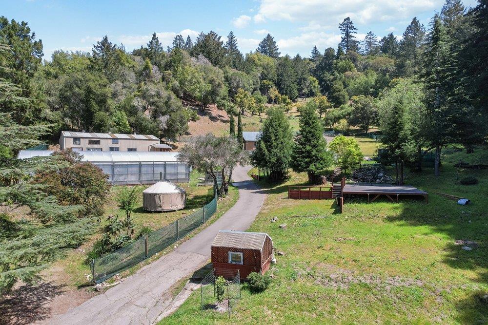 1003 Laurel Glen Road Soquel, CA 95073 - Photo 68 of 115 an aerial view of a house with swimming pool garden and lake view