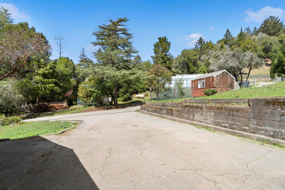 1003 Laurel Glen Road Soquel, CA 95073 - Photo 77 of 115 a house with trees in the background