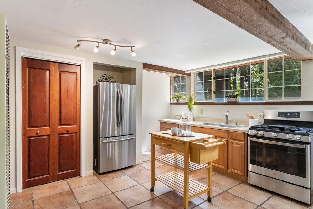 1003 Laurel Glen Road Soquel, CA 95073 - Photo 9 of 115 a kitchen with stainless steel appliances granite countertop a stove and a refrigerator