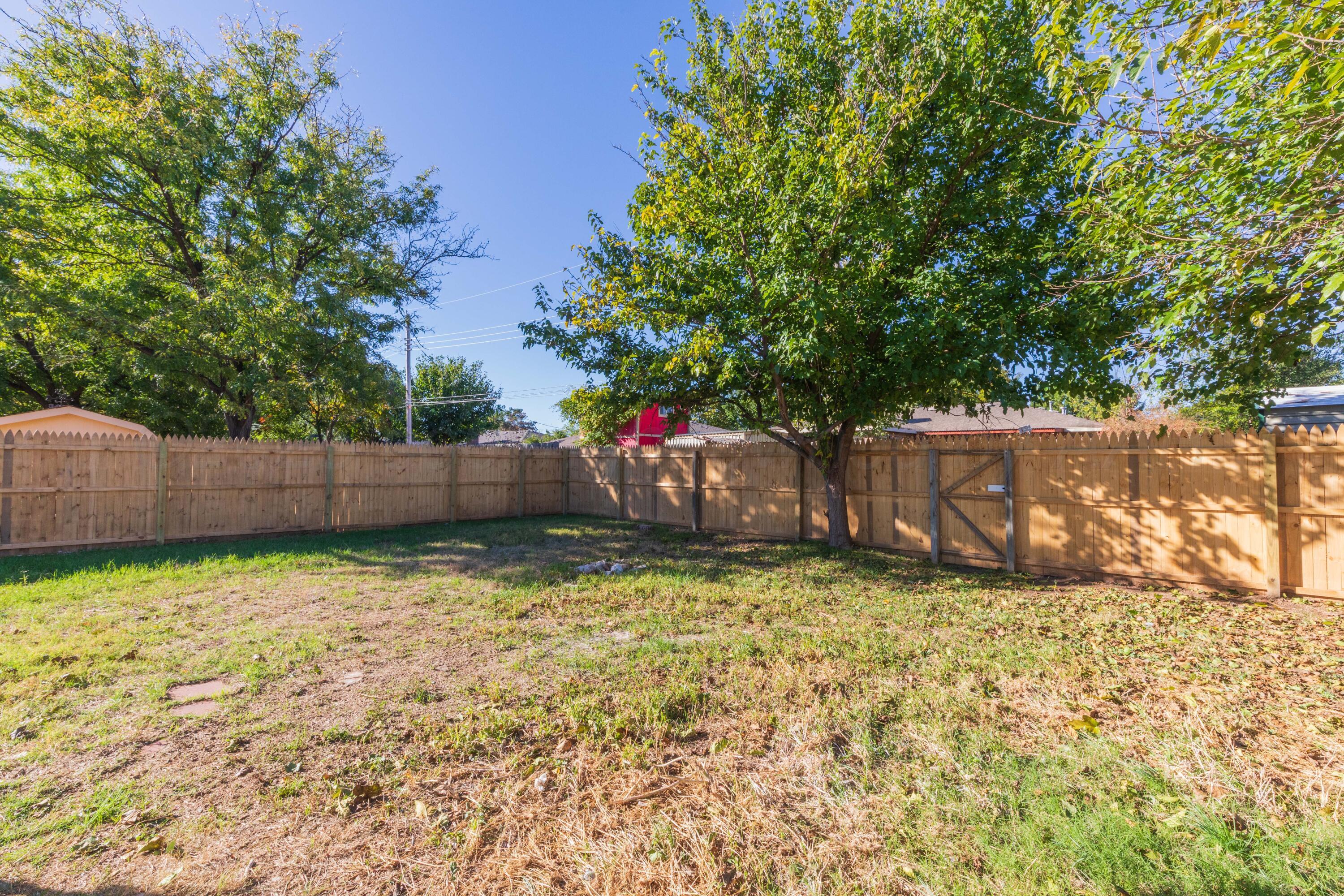 6104 Cornell Street Amarillo, TX 79109 - Photo 36 of 39 a backyard of a house with lots of green space