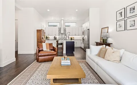 a living room with furniture and a rug