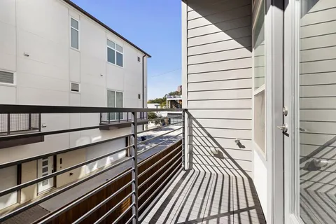 a view of balcony with wooden floor