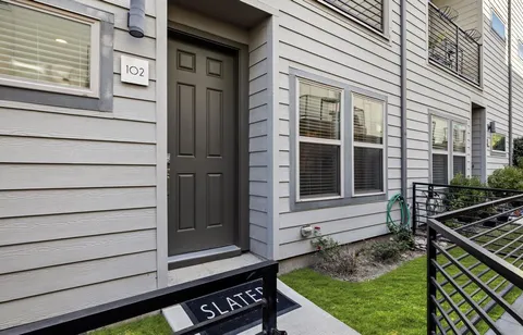 a view of house with backyard