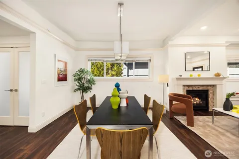 a view of a dining room with furniture and a fireplace