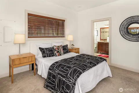 a bedroom with bed and a window