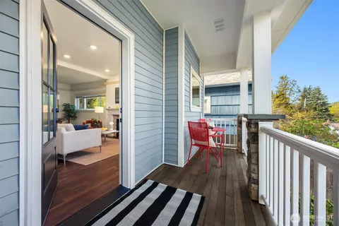 a view of a balcony with furniture