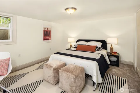 a bedroom with a bed and window