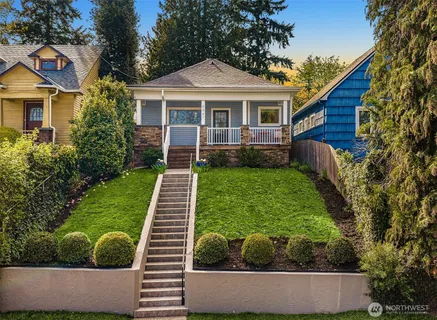 a front view of a house with garden