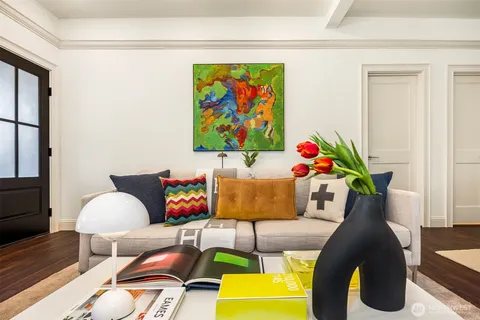 a living room with furniture and a rug