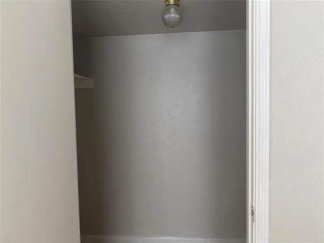 a view of a backyard with pathway