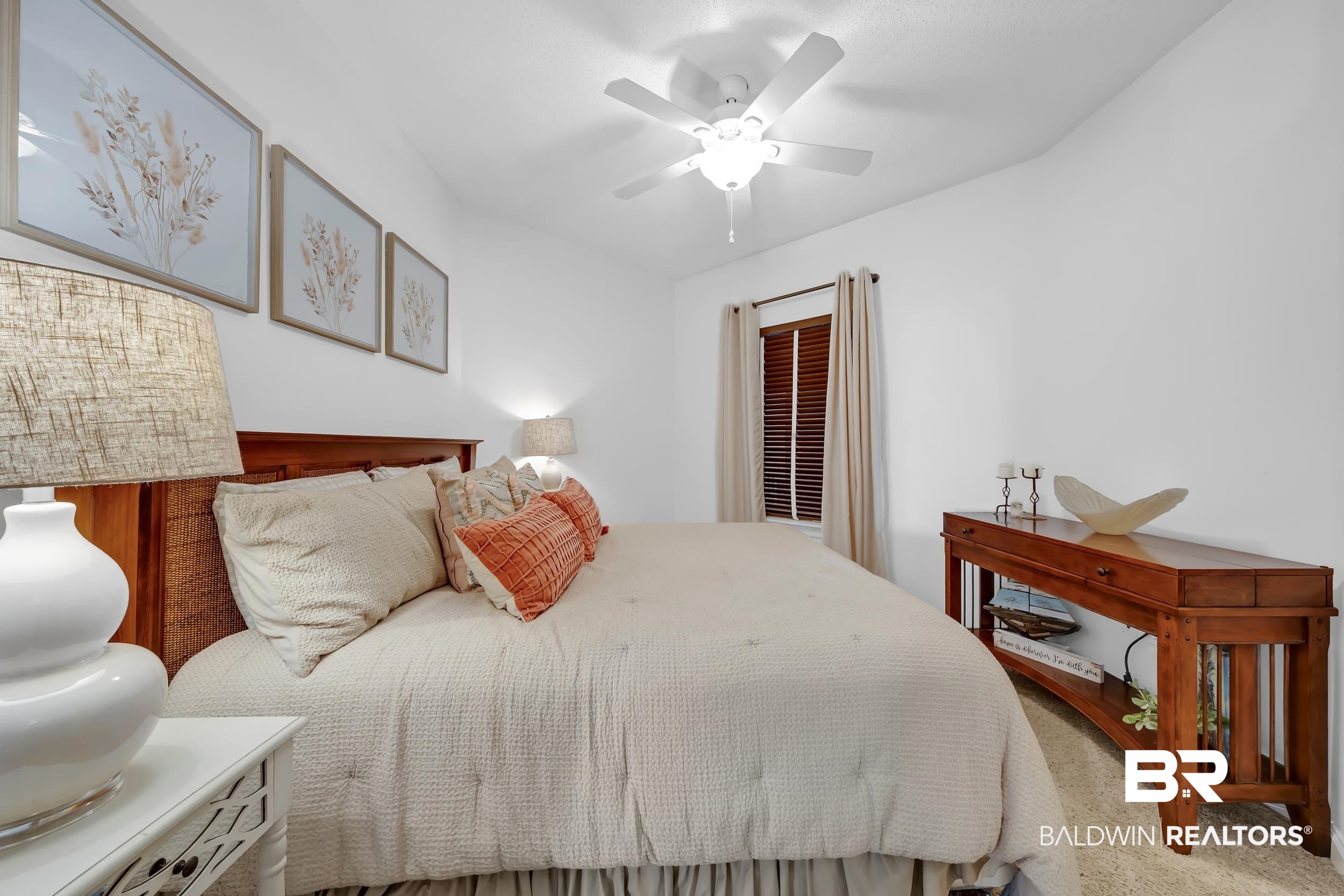 27282 Canal Road, Unit 104 Orange Beach, AL 36561 - Photo 47 of 79 Carpeted bedroom with ceiling fan