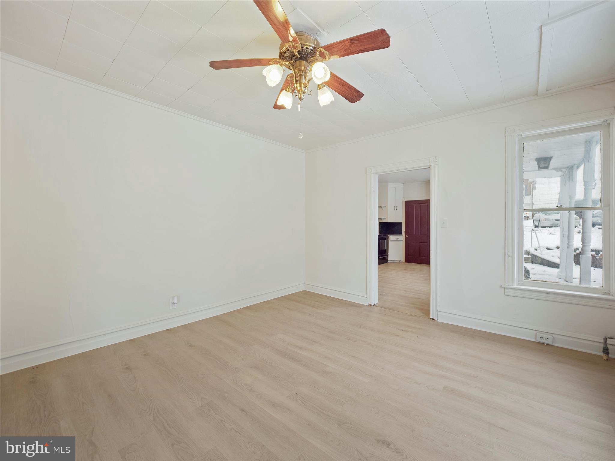228 Ridge Avenue Waynesboro, PA 17268 - Photo 11 of 32 an empty room with chandelier fan and windows