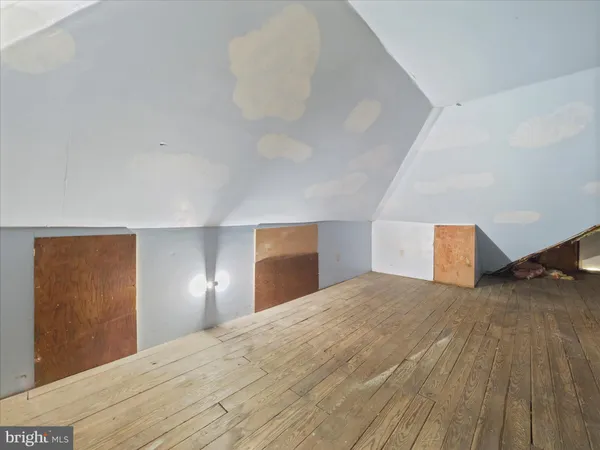 a bedroom with a bed and a lamp