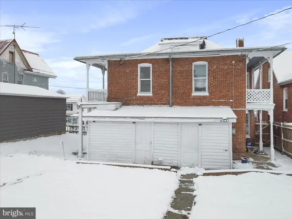 a front view of a house with garage