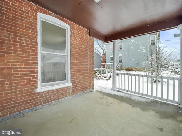 a view of an empty room and a window
