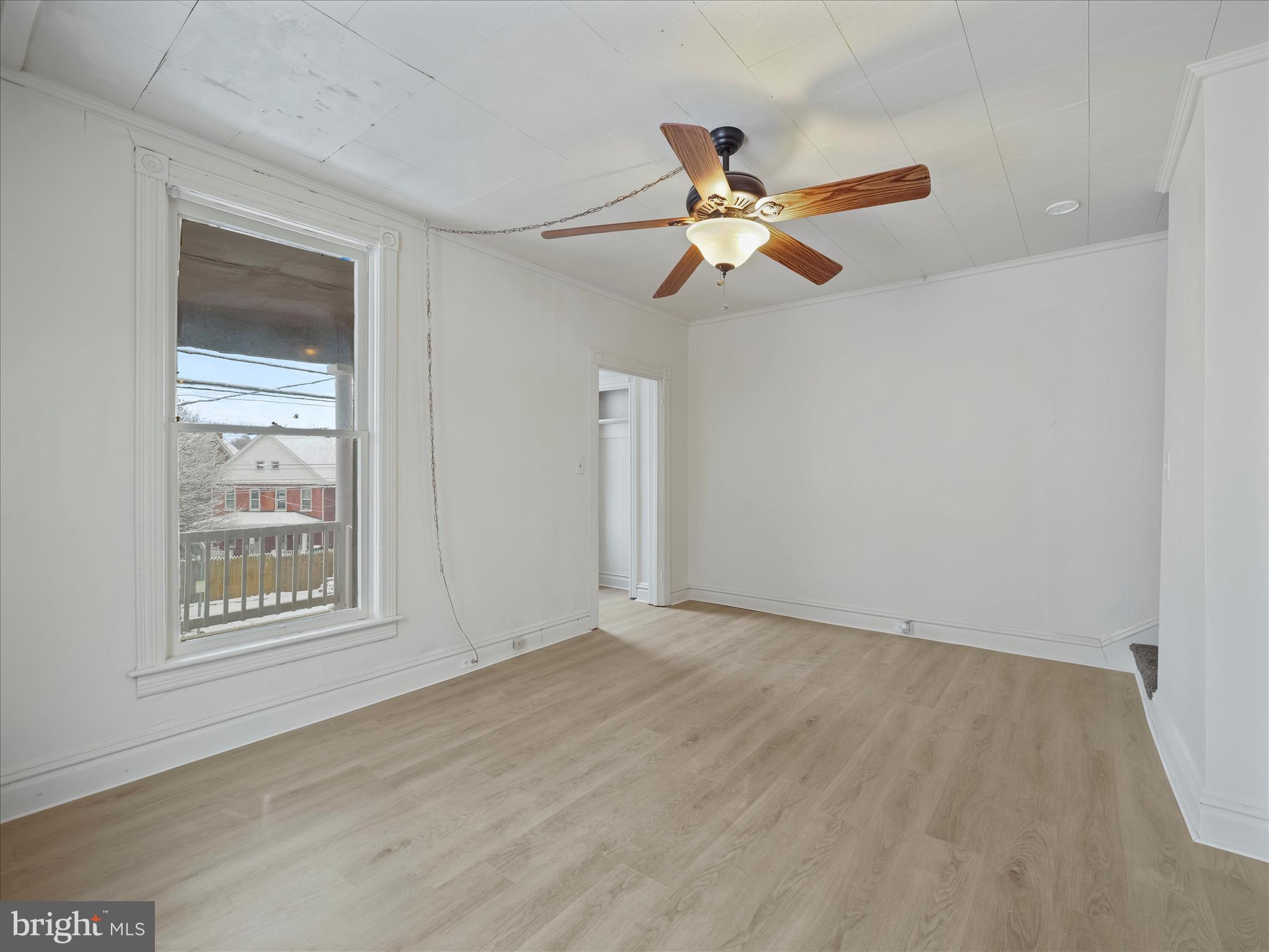 228 Ridge Avenue Waynesboro, PA 17268 - Photo 7 of 32 an empty room with windows and fan