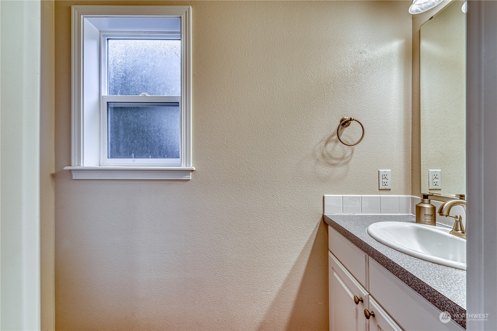 70 Northeast Wagon Wheel Road Belfair, WA 98528 - Photo 13 of 33 a bathroom with a sink a vanity and a mirror