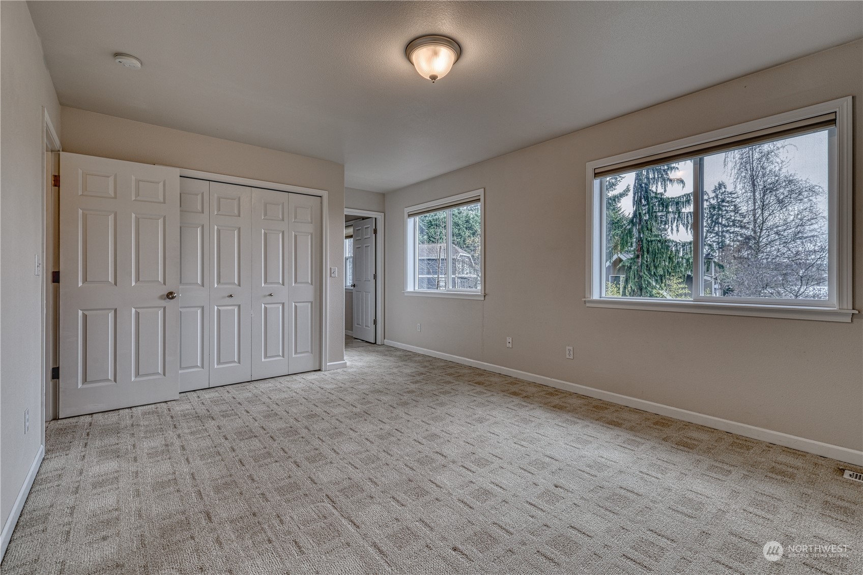 70 Northeast Wagon Wheel Road Belfair, WA 98528 - Photo 19 of 33 a view of an empty room with a window