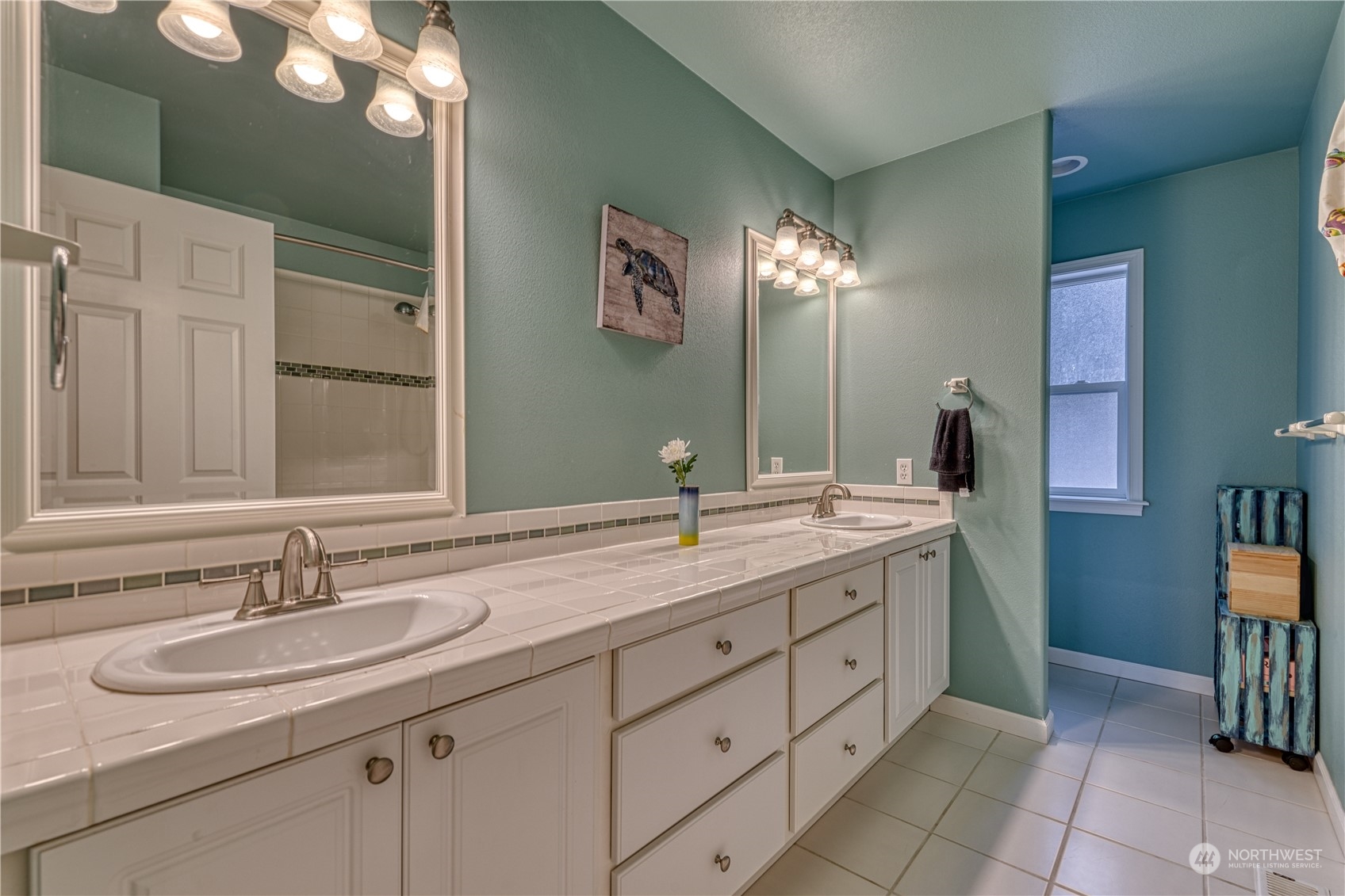 70 Northeast Wagon Wheel Road Belfair, WA 98528 - Photo 20 of 33 a bathroom with a double vanity sink and a mirror