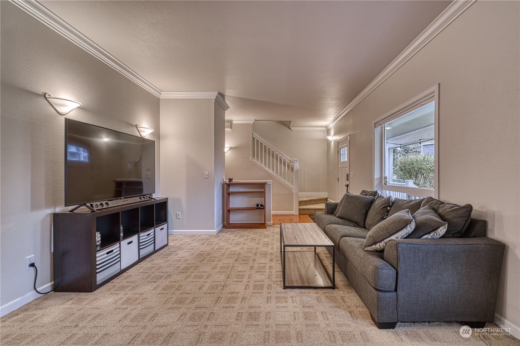 70 Northeast Wagon Wheel Road Belfair, WA 98528 - Photo 2 of 33 a living room with furniture and a flat screen tv