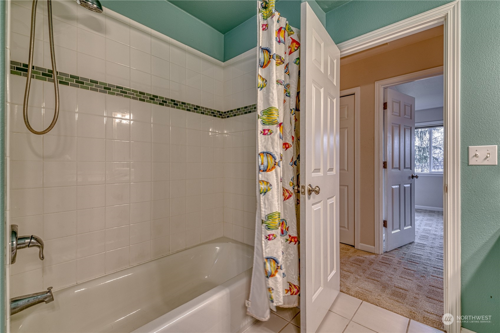 70 Northeast Wagon Wheel Road Belfair, WA 98528 - Photo 21 of 33 a bathroom with a shower and a tub