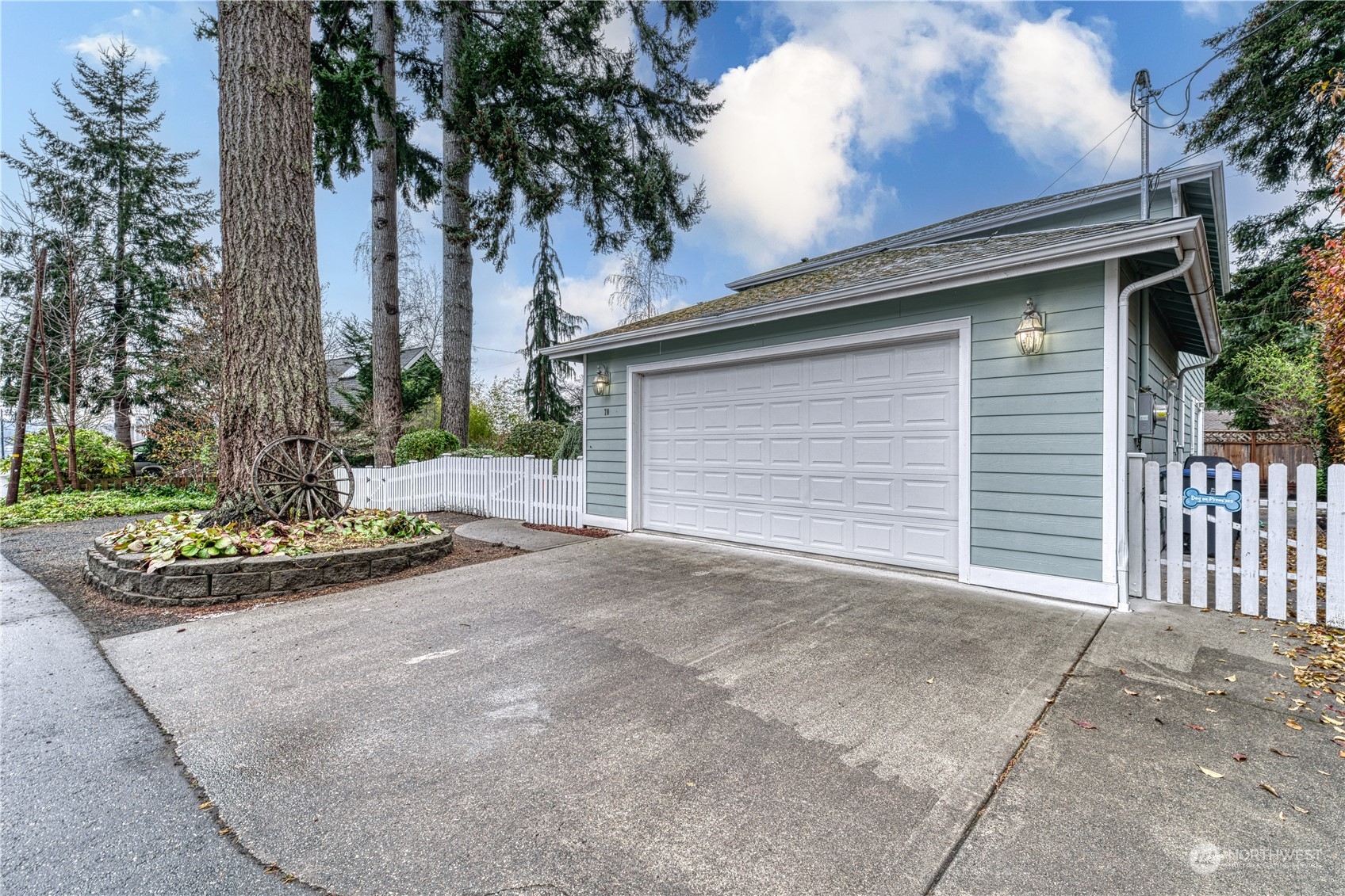70 Northeast Wagon Wheel Road Belfair, WA 98528 - Photo 24 of 33 a view of a house with a yard and garage