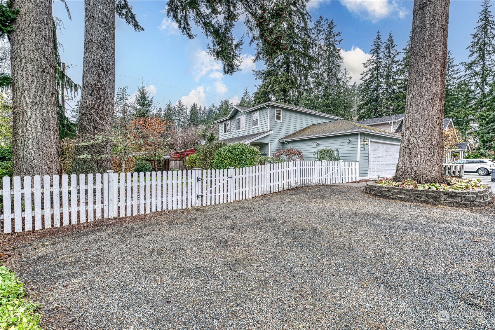 70 Northeast Wagon Wheel Road Belfair, WA 98528 - Photo 25 of 33 a view of a house with wooden fence