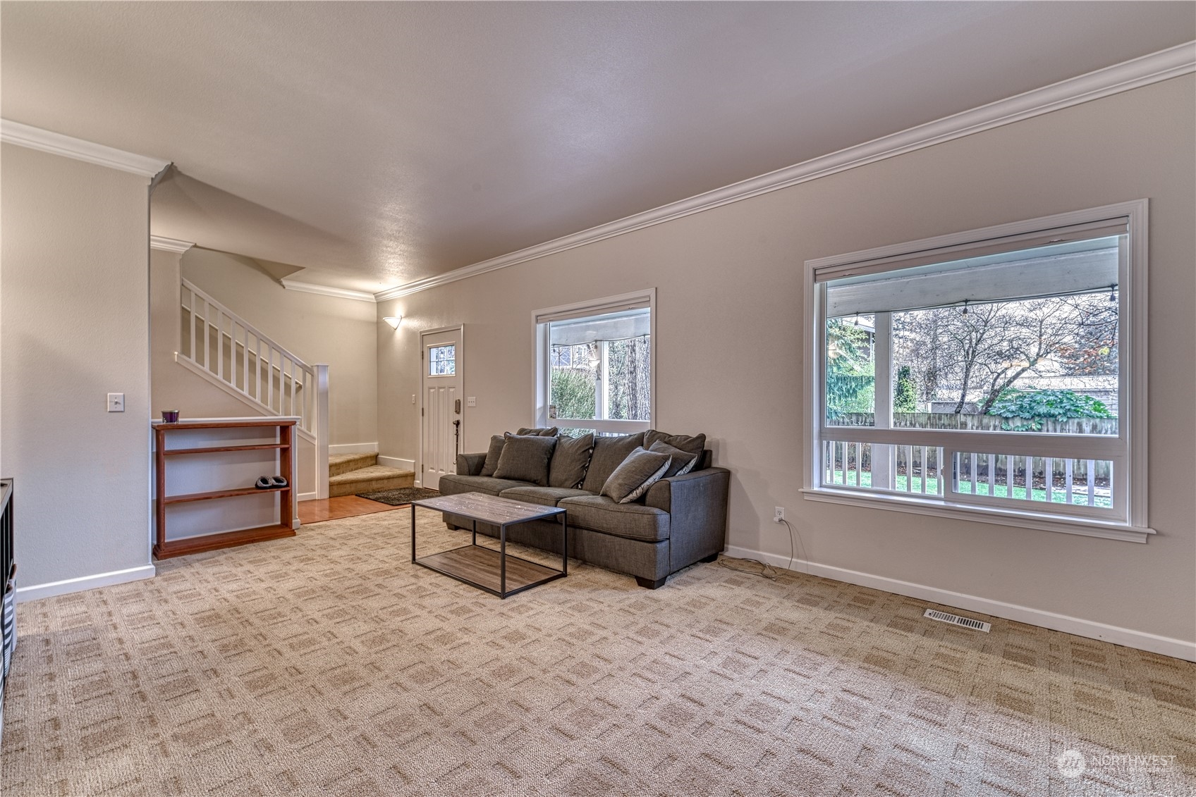 70 Northeast Wagon Wheel Road Belfair, WA 98528 - Photo 3 of 33 a living room with furniture a fireplace and a window