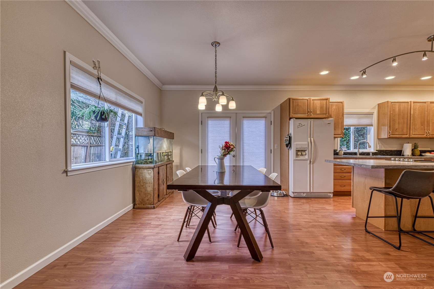 70 Northeast Wagon Wheel Road Belfair, WA 98528 - Photo 5 of 33 a dining room filled chandelier and kitchen view
