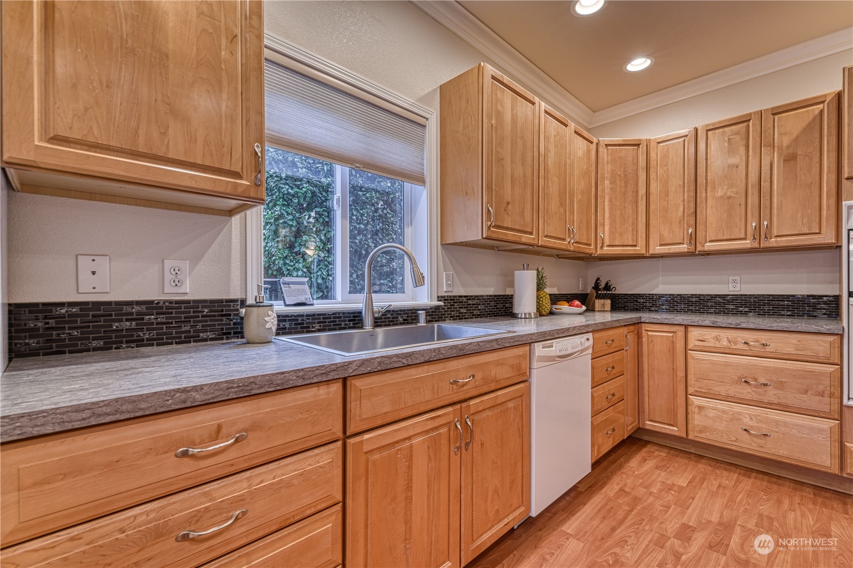 70 Northeast Wagon Wheel Road Belfair, WA 98528 - Photo 9 of 33 a kitchen with granite countertop stainless steel appliances white cabinets granite counter tops and a window