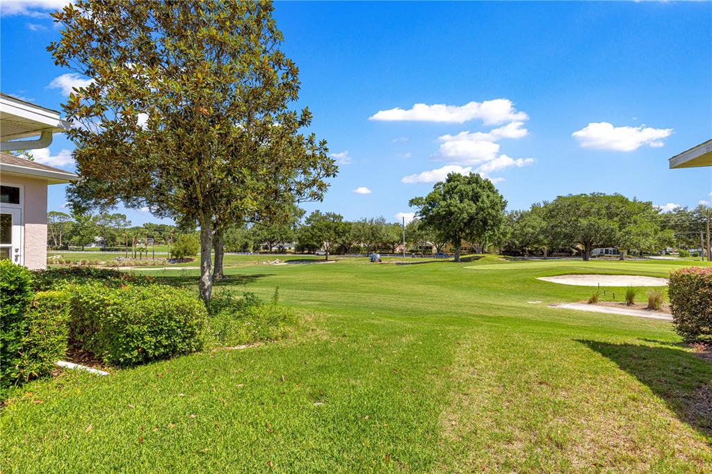 9317 Southwest 94th Loop Ocala, FL 34481 - Photo 32 of 40 a view of an outdoor space and a yard