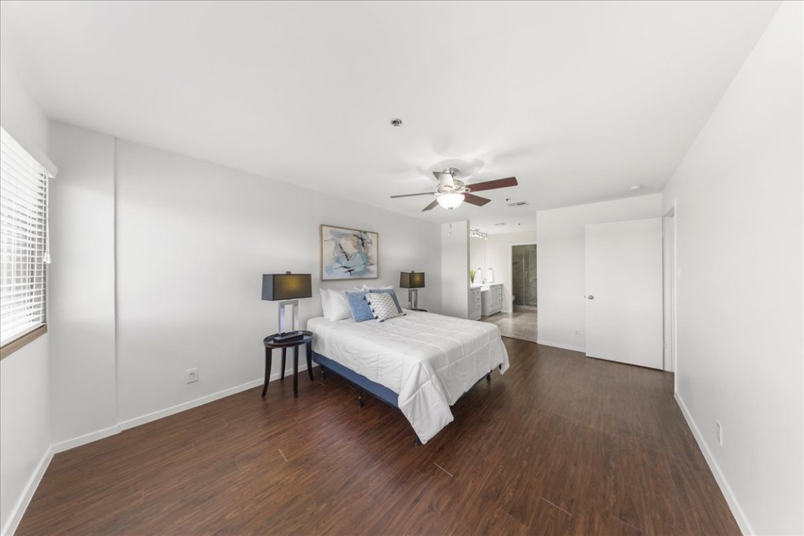 40 North Interstate Highway 35, Unit 6B3 Austin, TX 78701 - Photo 8 of 32 a bedroom with a bed and a chandelier