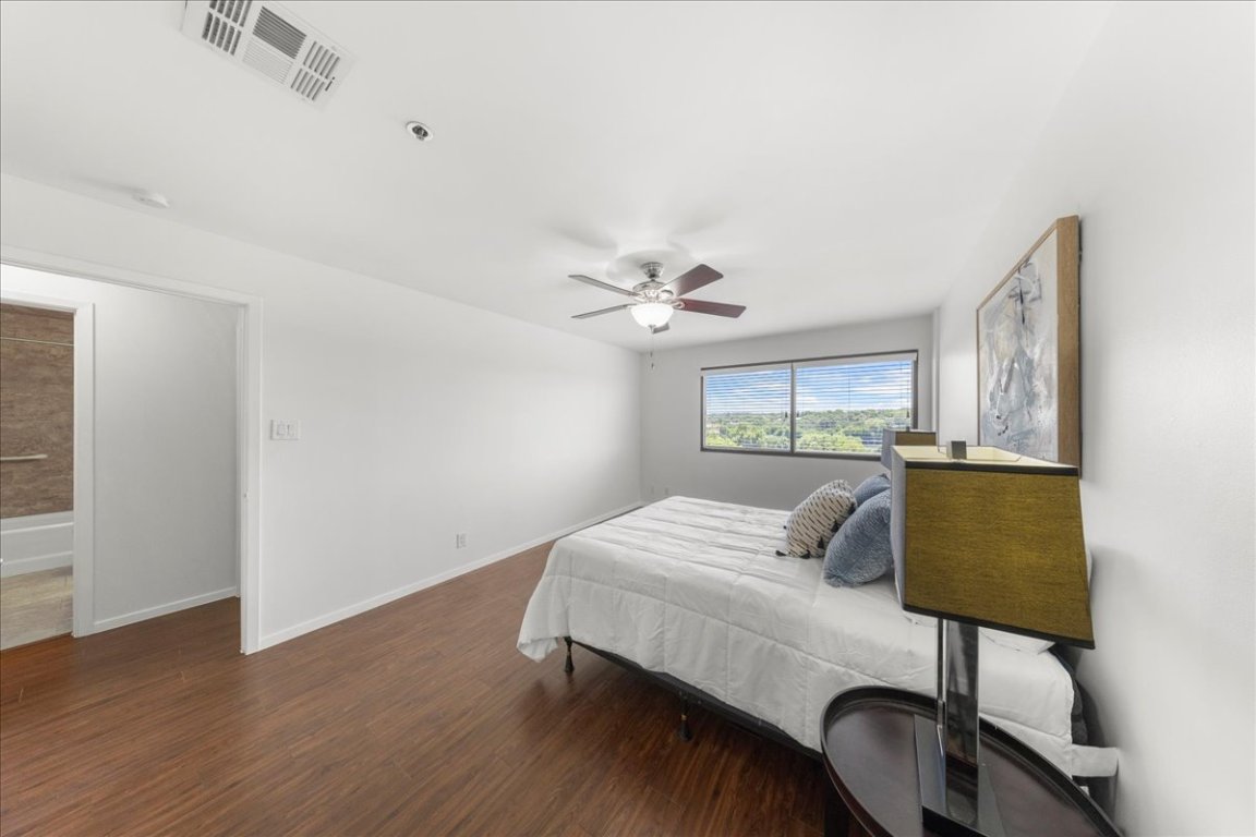 40 North Interstate Highway 35, Unit 6B3 Austin, TX 78701 - Photo 9 of 32 a bedroom with a bed and a chair