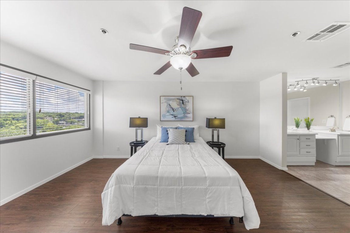 40 North Interstate Highway 35, Unit 6B3 Austin, TX 78701 - Photo 10 of 32 a bed room with a bed and a chandelier