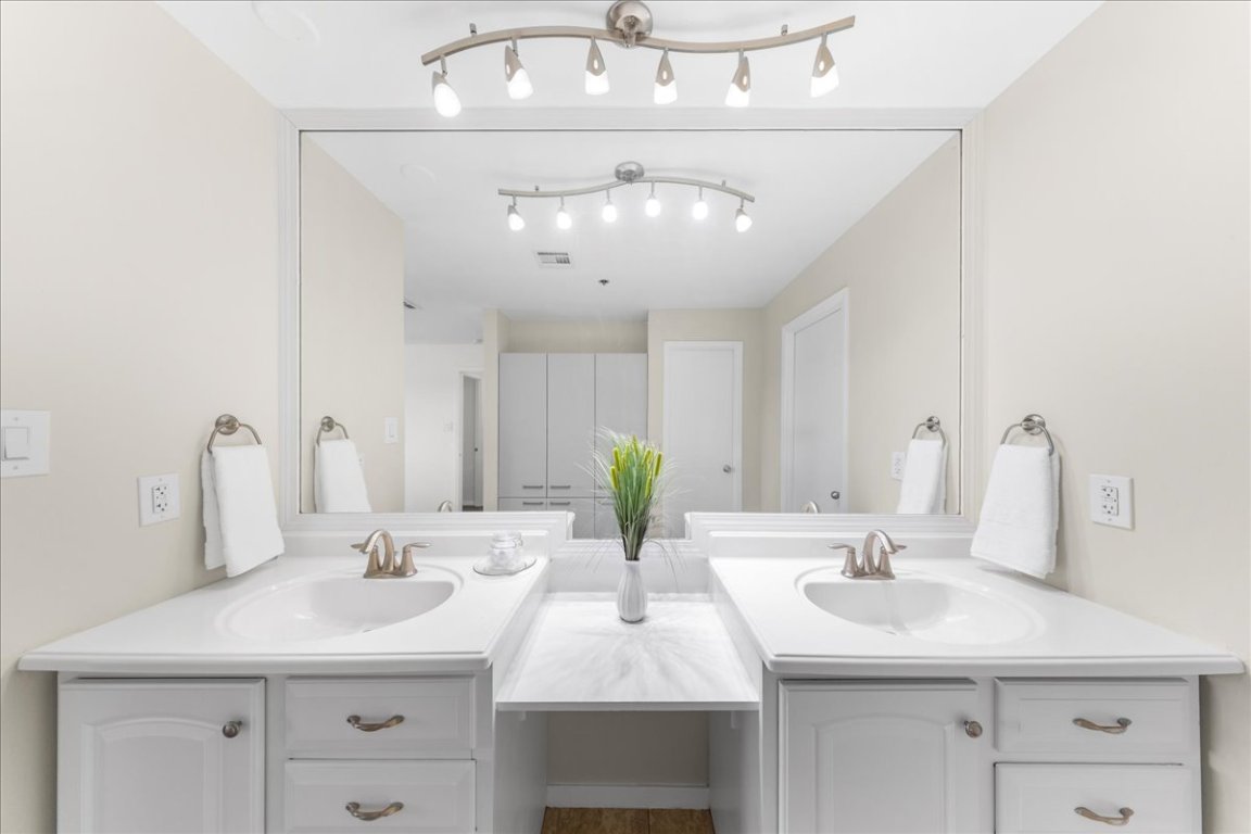 40 North Interstate Highway 35, Unit 6B3 Austin, TX 78701 - Photo 12 of 32 a bathroom with a sink double vanity and a mirror