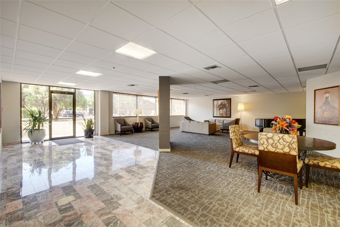40 North Interstate Highway 35, Unit 6B3 Austin, TX 78701 - Photo 27 of 32 a living room with furniture and a table