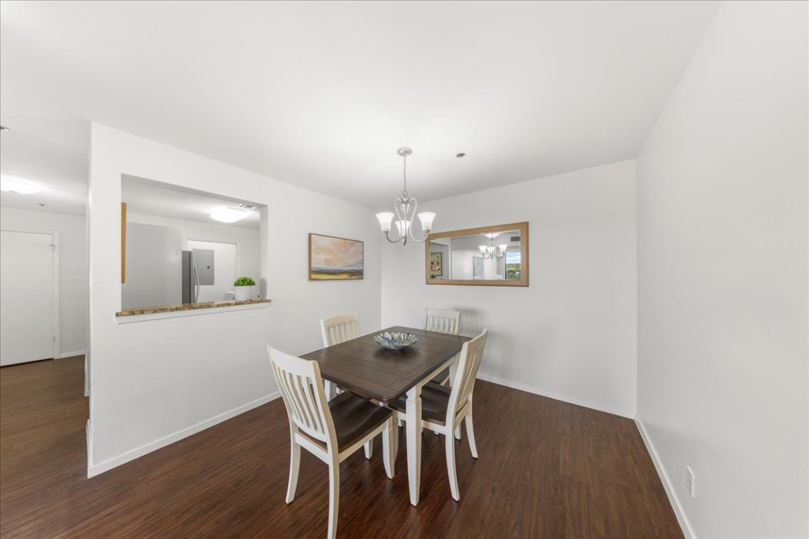 40 North Interstate Highway 35, Unit 6B3 Austin, TX 78701 - Photo 3 of 32 a view of a dining room with furniture and wooden floor