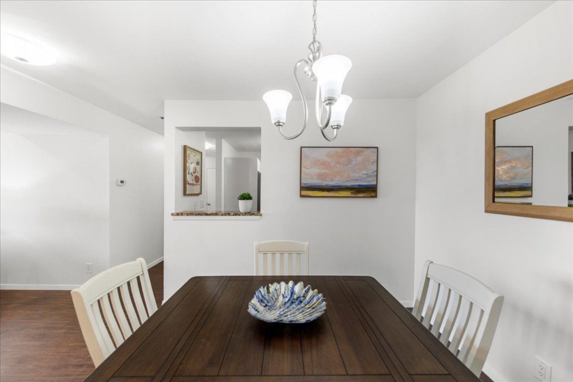 40 North Interstate Highway 35, Unit 6B3 Austin, TX 78701 - Photo 4 of 32 a view of a hallway with wooden floor and a chandelier