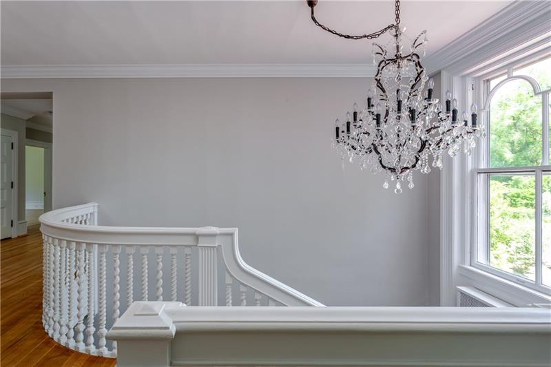 520 Pine Road Sewickley, PA 15143 - Photo 12 of 23 The upper hall features an impressive chandelier and a grand window.
