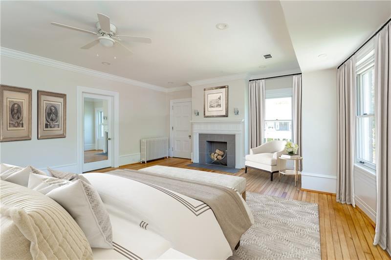 520 Pine Road Sewickley, PA 15143 - Photo 14 of 23 With an en-suite bathroom, a fireplace, tall ceilings and beautifully-restored hardwood floors, this bedroom is a lovely, quiet retreat.