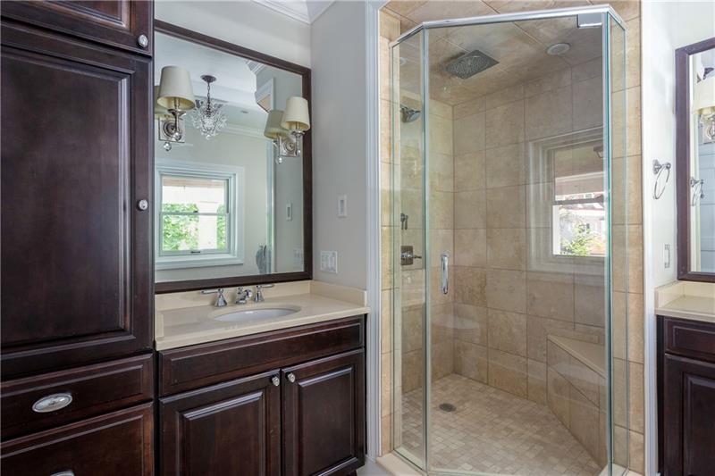 520 Pine Road Sewickley, PA 15143 - Photo 20 of 23 Handsome master bath features custom cabinetry, two vanities and shower with ceramic surround.