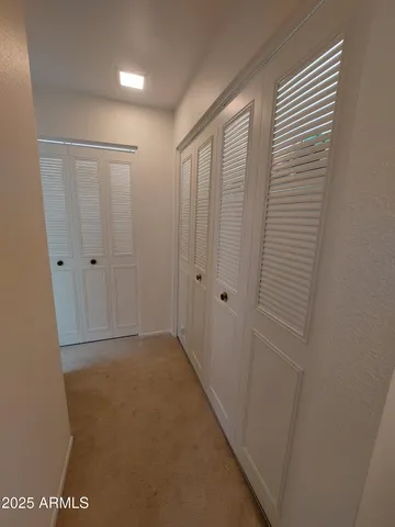 a bedroom with a bed and a walk in closet