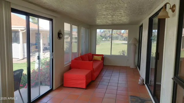 a living room with furniture and a rug