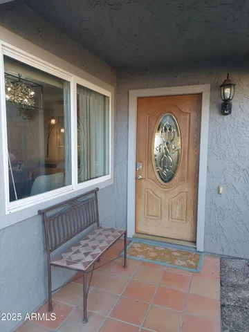 a view of a room with a wooden door
