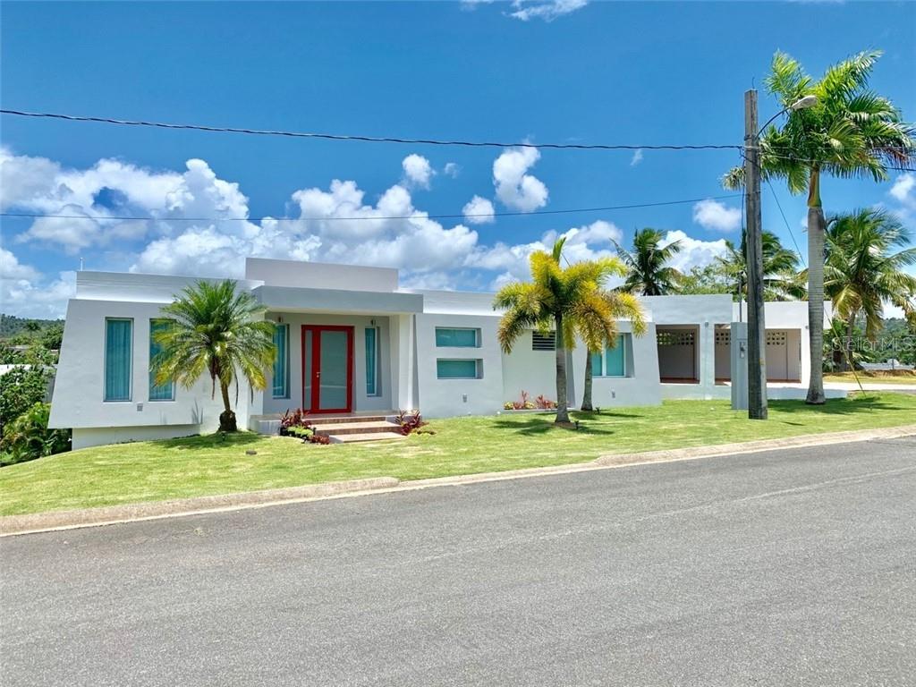 front view of a house with a yard
