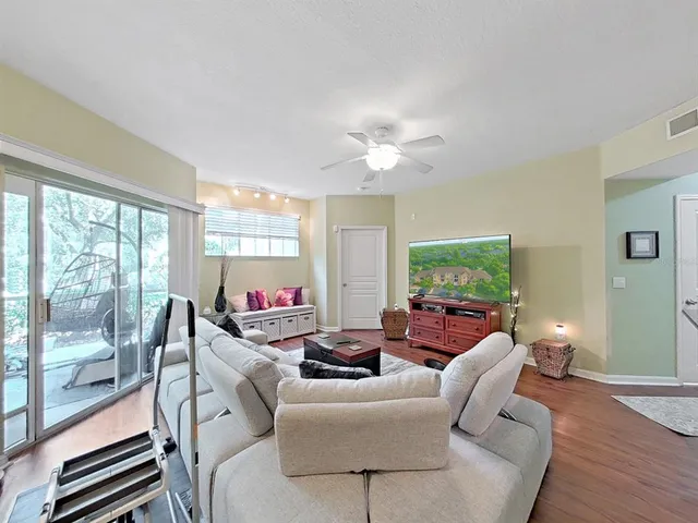a living room with furniture and a large window