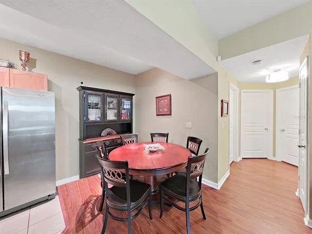 a dining room with furniture and window