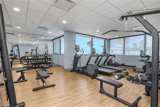 a living room with lots of furniture and a rug